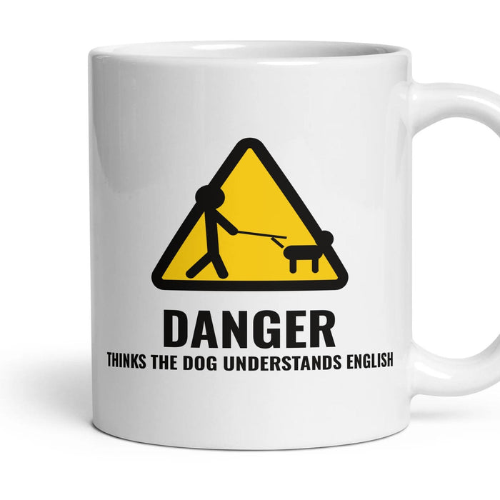 DANGER: THINKS THE DOG UNDERSTANDS ENGLISH mug, 11oz white ceramic, handle right