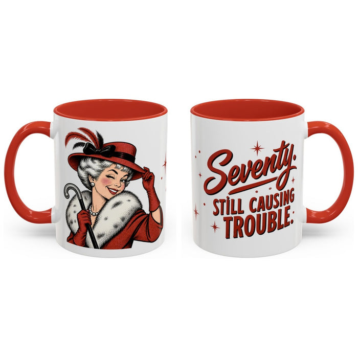 Seventy. Still causing trouble. mug, 11oz white ceramic, red handle and interior, handle right